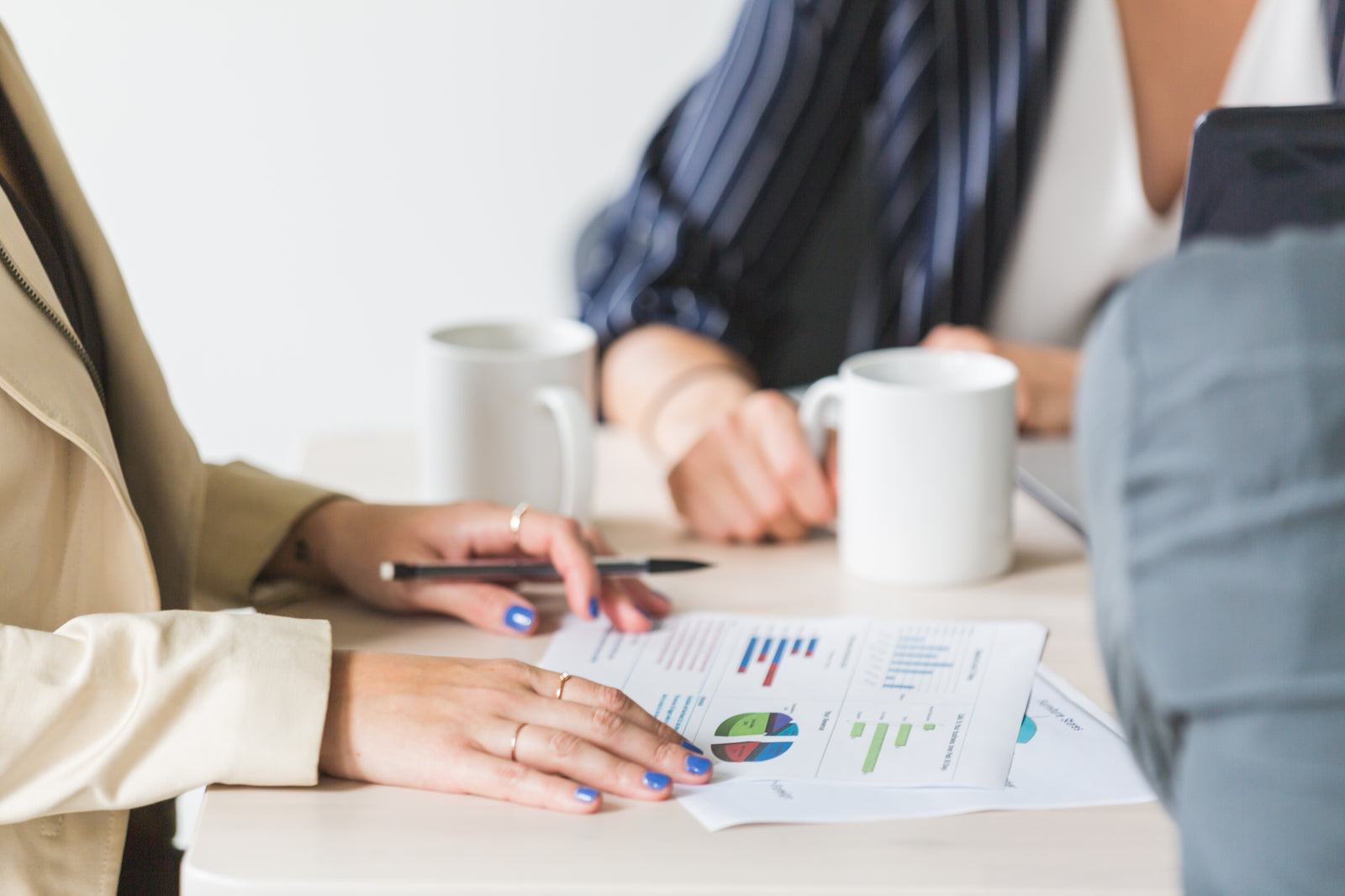 Buyers reviewing figures in a meeting