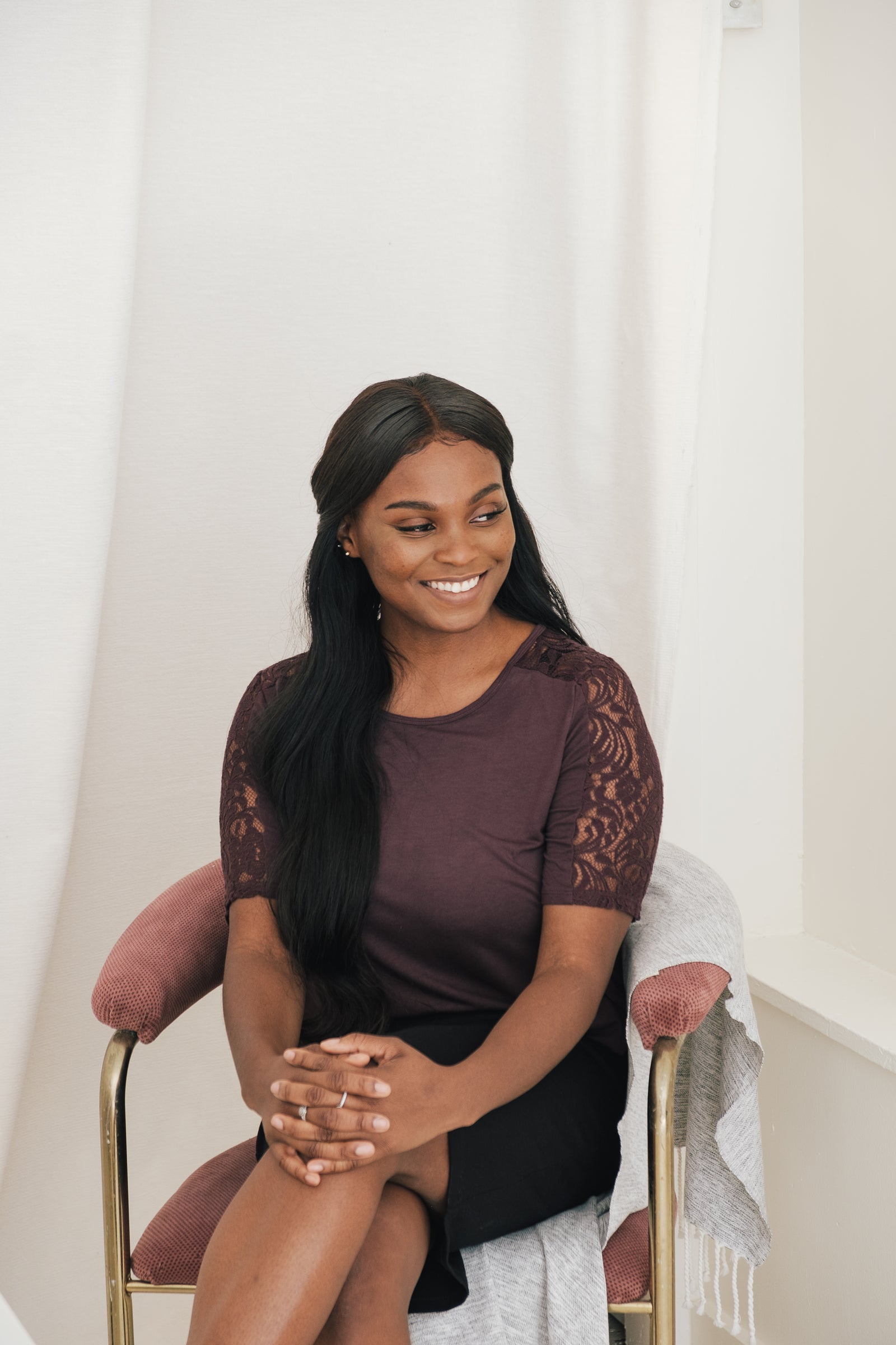 A business owner smiling in her shop